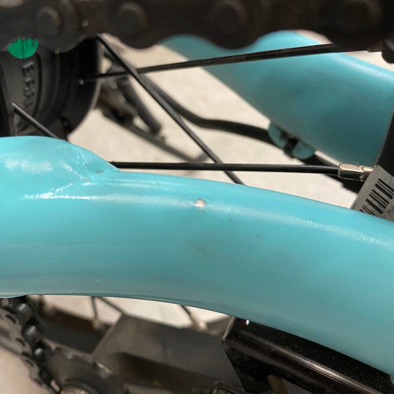 Small paint chip on rear swing arm