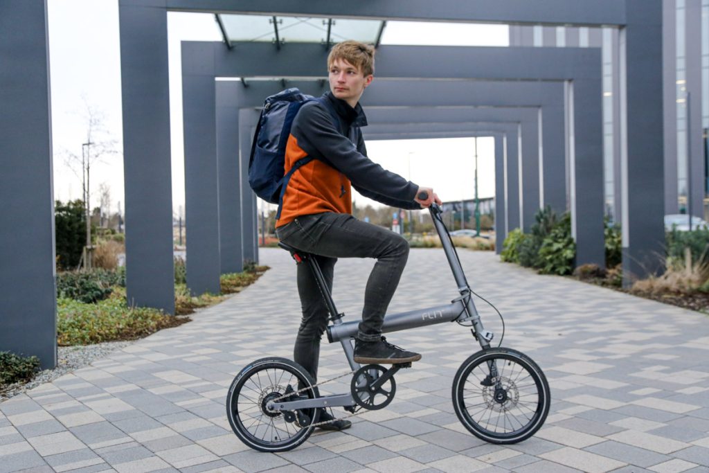 FLIT M2 folding ebike being ridden by young man