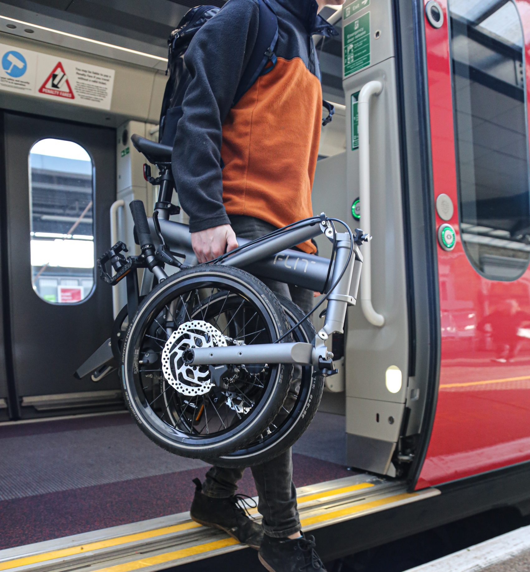 Getting off the train at Cambridge station with FLIT M2 folding ebike